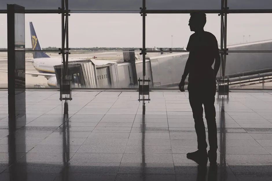 Traveller silhouette inside El Prat airport with airplane reflections, ready to activate a Spain eSIM