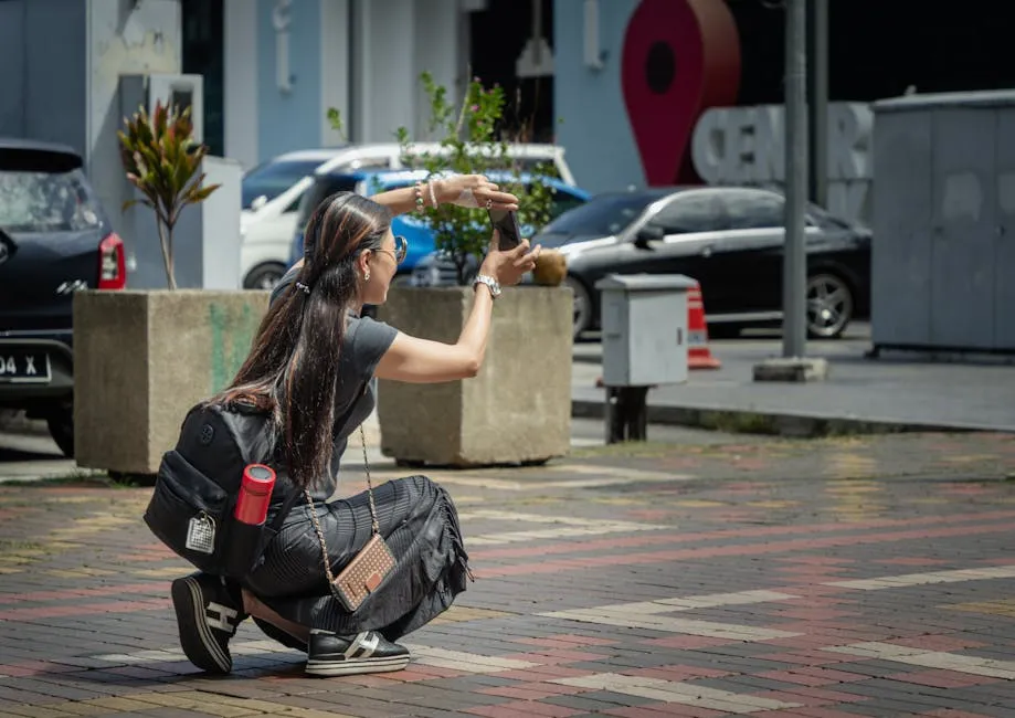 Traveller using smartphone on a Kuala Lumpur street after activating a Malaysia eSIM