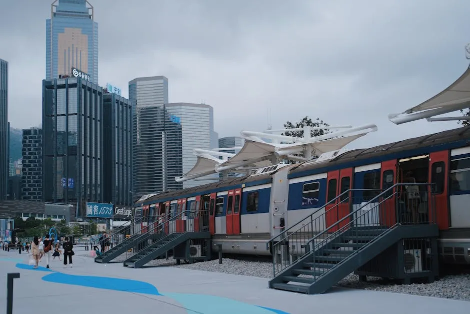 Hong Kong MTR train platform with skyscrapers overhead