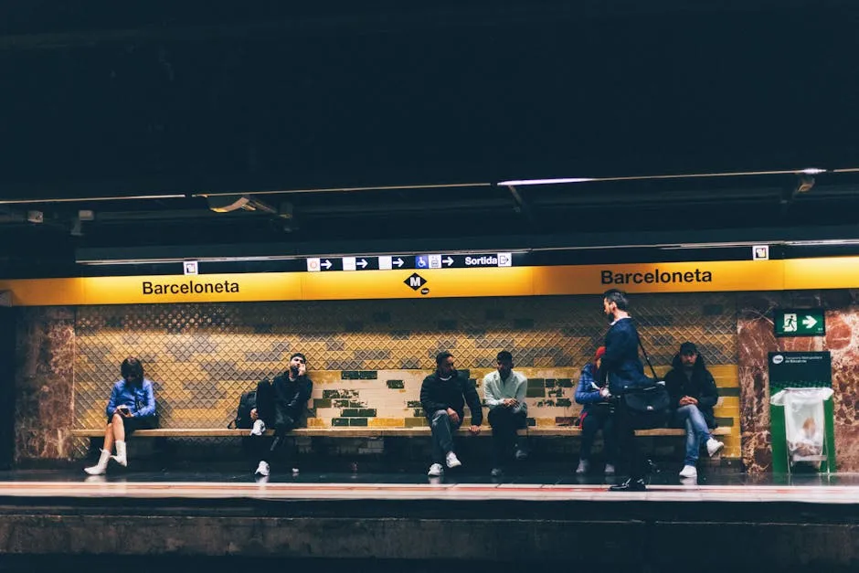 Commuters waiting at Barceloneta metro station in Barcelona Spain