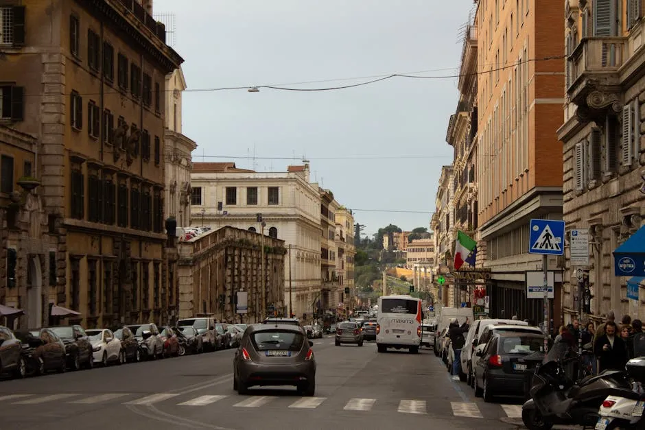 Busy street scene in Rome Italy with traffic and architecture