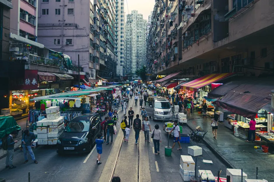 Bustling Hong Kong street market at twilight with vendors and shoppers