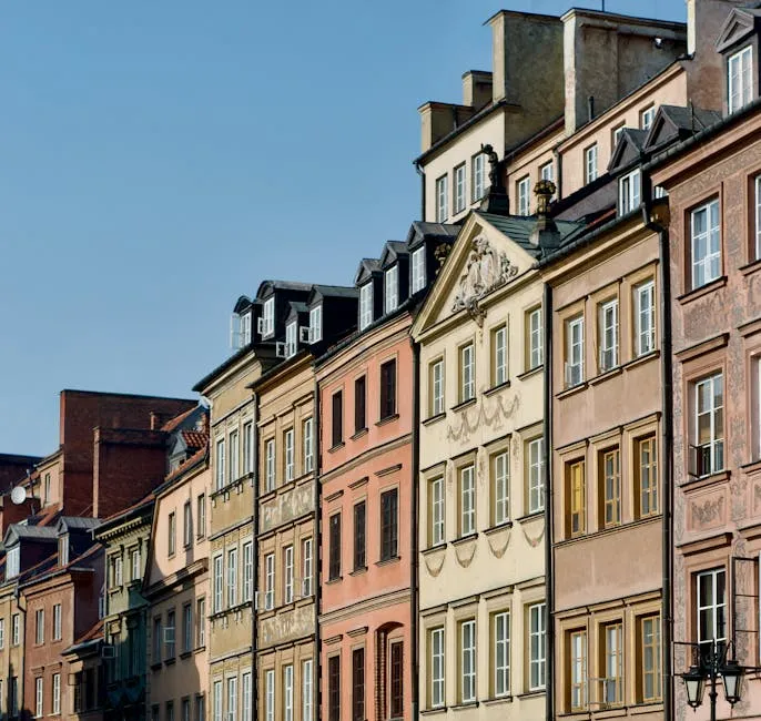 Colorful historic houses in Warsaw Old Town, Poland, on a sunny day.