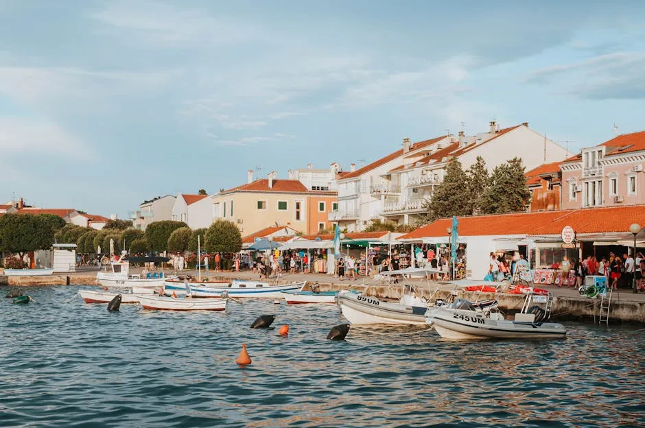 Croatian waterfront with boats and shops - Adriatic coast Croatia