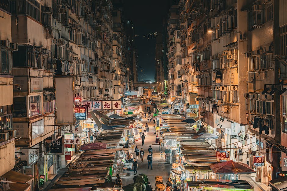 Night market street in Hong Kong, Asia showing busy street life