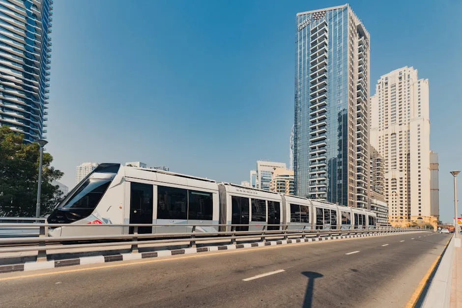 Dubai Metro train running alongside skyscrapers in the city centre